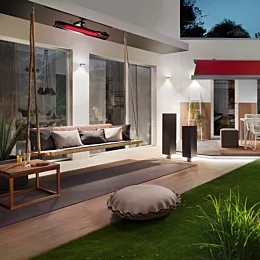 Heatscope Pure 3000W Radiant Heater mounts above the cushioned patio setting in a private residence, supplying efficient outdoor infrared heat.