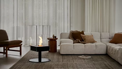 EcoSmart Fire Orbit Designer Fireplace elevates this indoor private residence, freestanding glass bioethanol focal point.