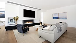 EcoSmart Fire Flex 68BY Flex Fireplace built-in bay ethanol fireplace warms Foote Street Brighton living room with ventless clean flame.