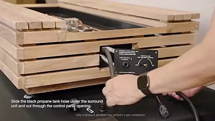 How to Assemble and Operate your Gas Fireplace? 6 Routing the black propane hose through the control panelopening